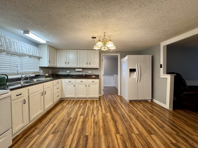 kitchen with white fridge with ice dispenser, a sink, electric range, and wood finished floors