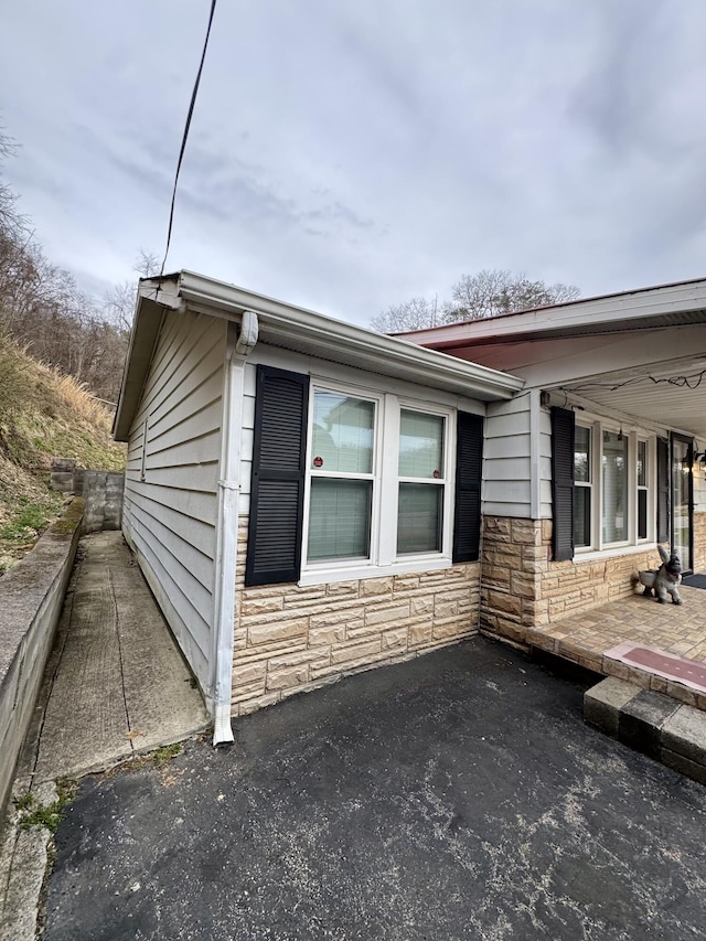 view of home's exterior with stone siding