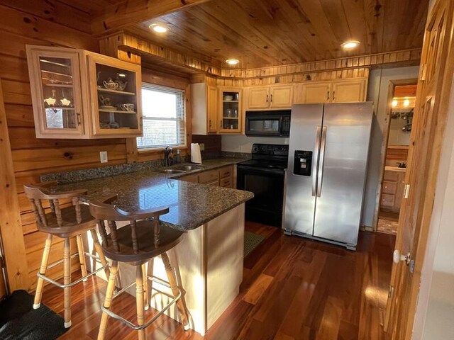 kitchen featuring dark wood-type flooring, a sink, wooden ceiling, a peninsula, and black appliances