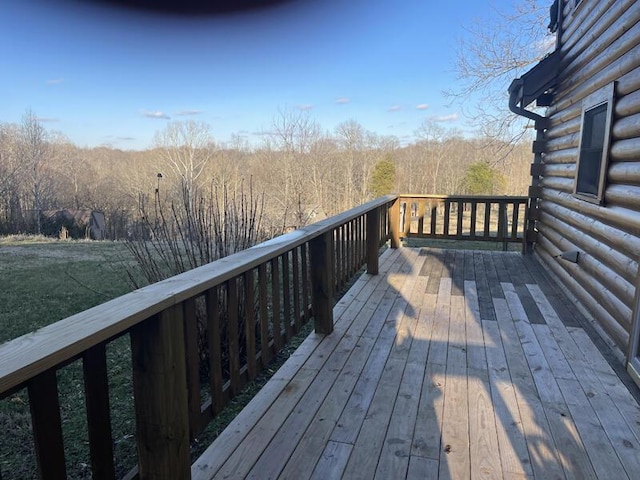 deck featuring a view of trees