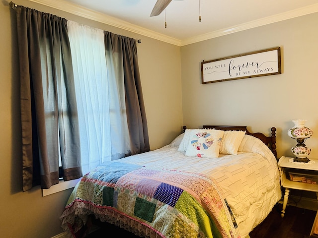 bedroom with a ceiling fan and ornamental molding