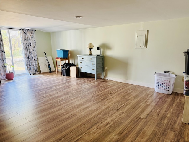 misc room featuring wood finished floors and baseboards