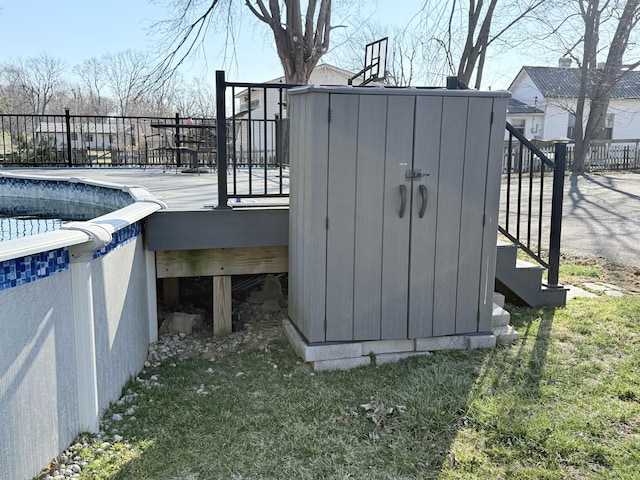 exterior space featuring a fenced in pool and fence