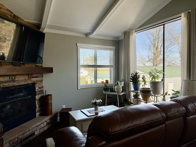 living room featuring vaulted ceiling with beams and a fireplace