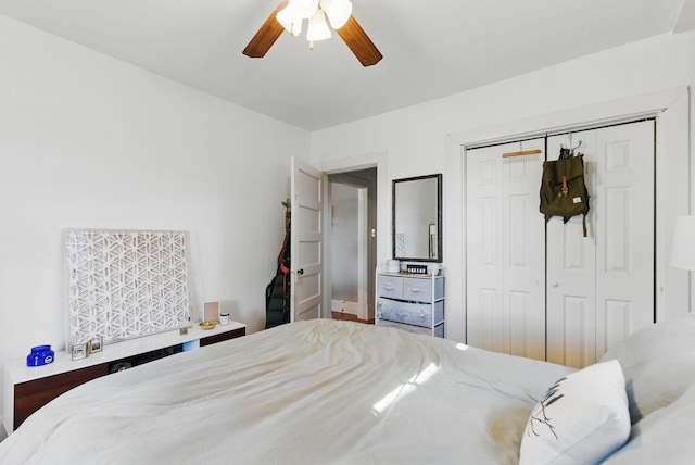 bedroom featuring ceiling fan and a closet
