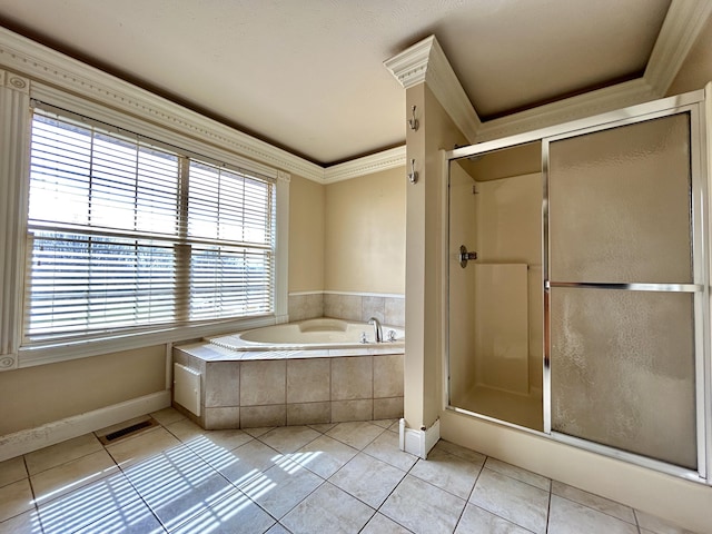 bathroom featuring a stall shower, visible vents, tile patterned floors, a garden tub, and crown molding