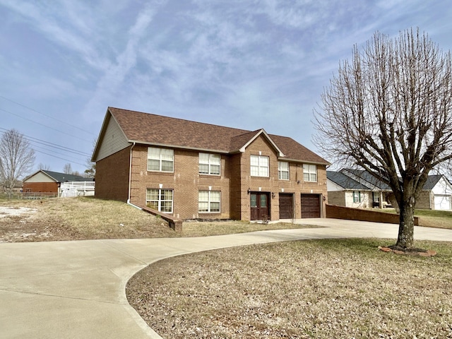 view of front of property featuring driveway, roof with shingles, and brick siding