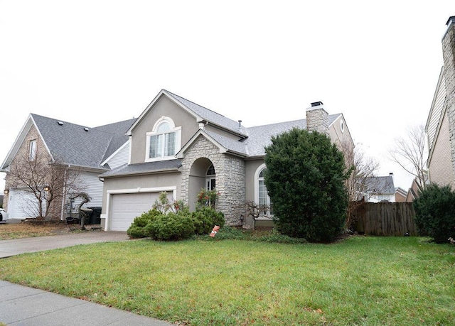 traditional-style house featuring stucco siding, an attached garage, fence, driveway, and a front lawn