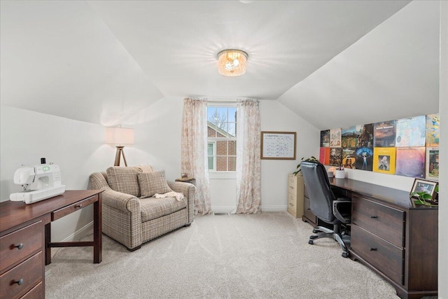 home office with light carpet, baseboards, and lofted ceiling