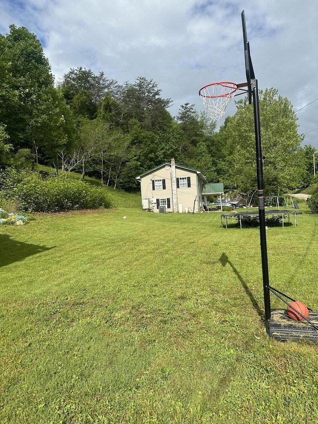 view of yard featuring a trampoline