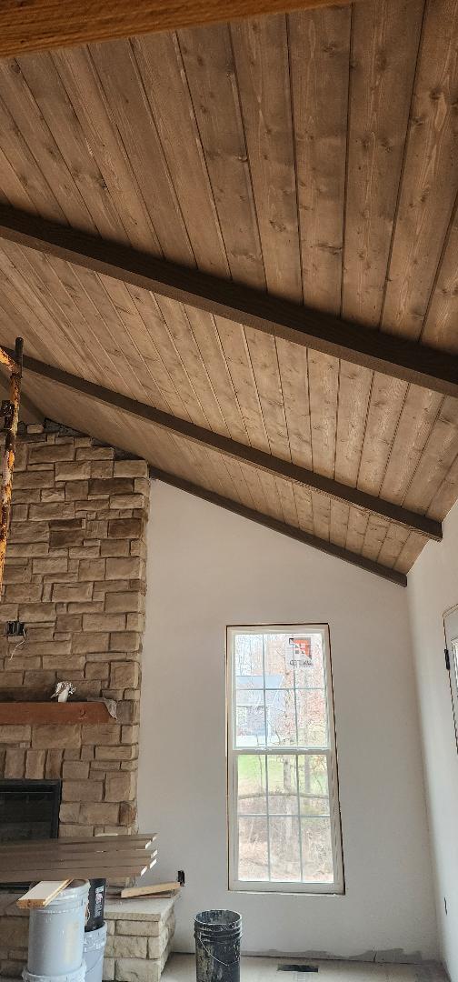 interior details featuring wooden ceiling, a fireplace, and beam ceiling