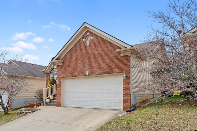 view of home's exterior featuring driveway and brick siding