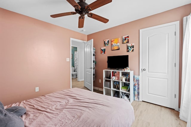 bedroom with light wood-type flooring and a ceiling fan