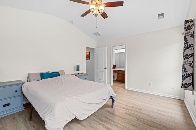 bedroom featuring visible vents, vaulted ceiling, light wood-style flooring, and baseboards