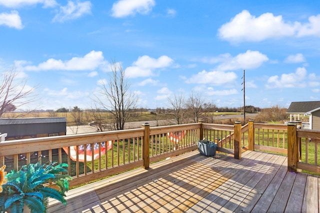 wooden terrace with a rural view