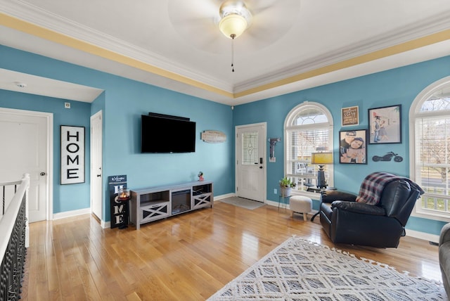 living room with plenty of natural light, baseboards, and hardwood / wood-style flooring