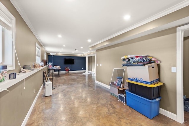 interior space featuring finished concrete floors, baseboards, ornamental molding, and recessed lighting