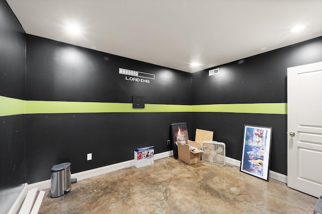 empty room featuring baseboards, visible vents, and concrete flooring