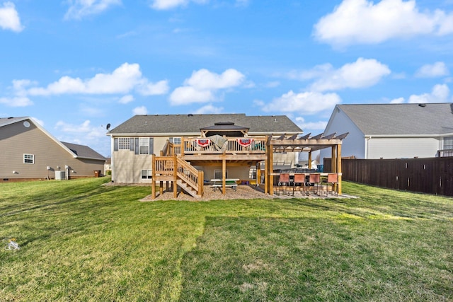 back of property featuring outdoor dry bar, a yard, fence, and a pergola