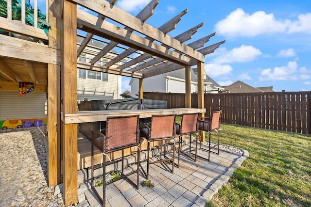 view of patio / terrace with fence, outdoor dry bar, and a pergola