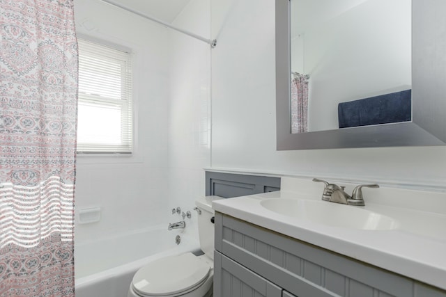 bathroom featuring shower / tub combo, vanity, and toilet