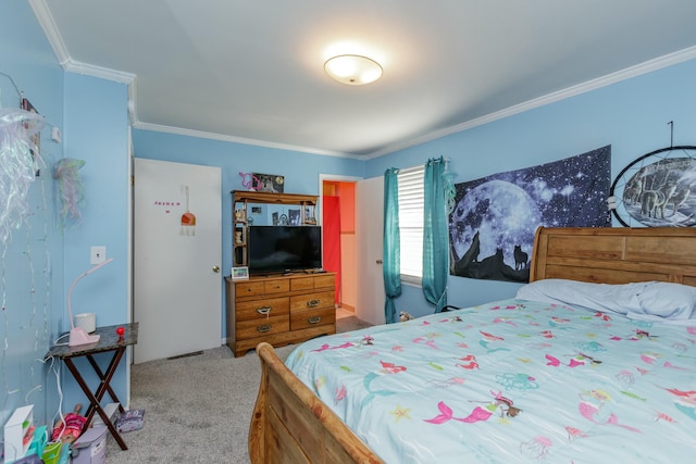 bedroom with ornamental molding and carpet