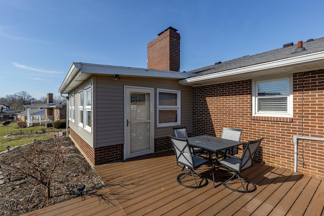 wooden deck featuring outdoor dining space