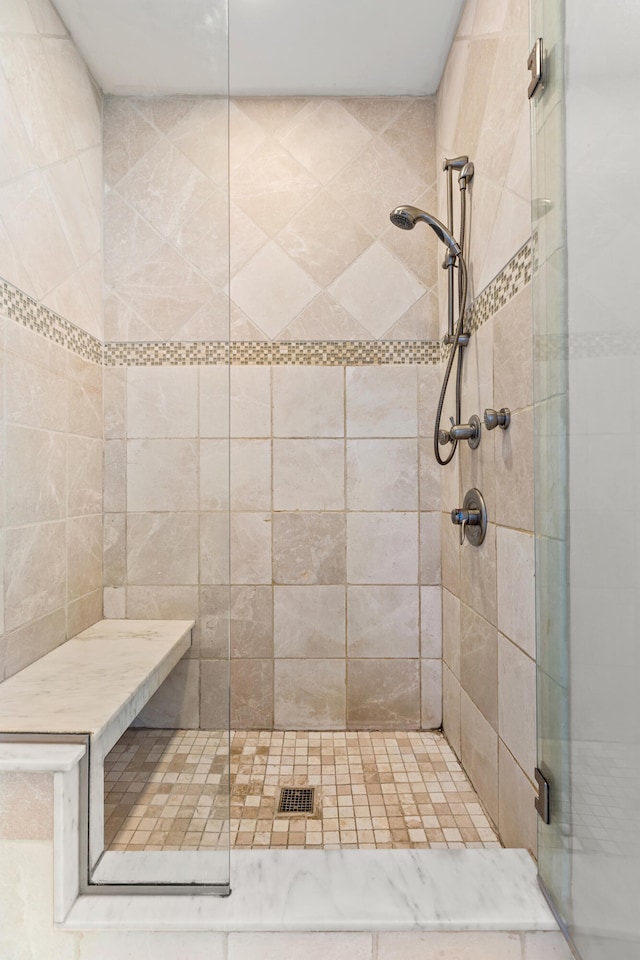 full bathroom featuring a stall shower