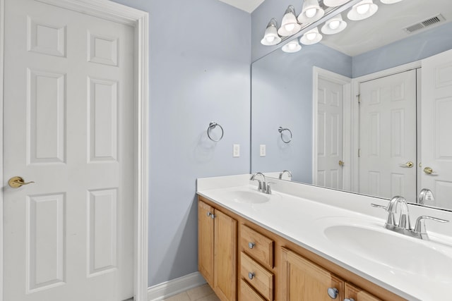 full bath with tile patterned flooring, visible vents, a sink, and double vanity