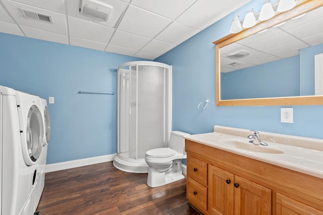 bathroom with a shower stall, visible vents, and wood finished floors