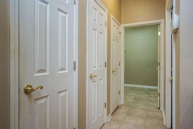 corridor featuring light tile patterned floors