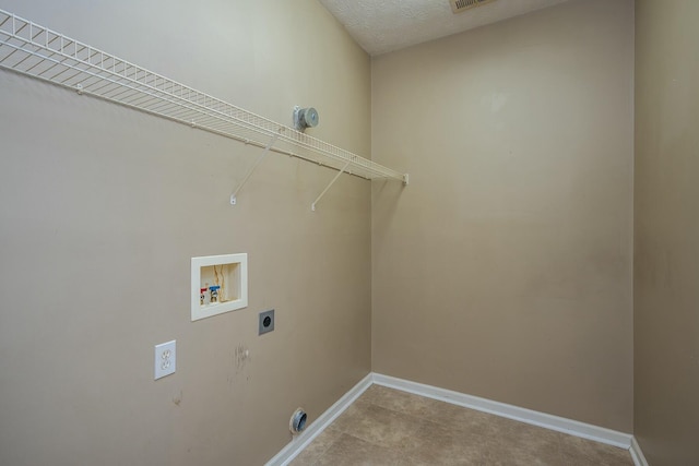 clothes washing area with washer hookup, laundry area, hookup for an electric dryer, and baseboards