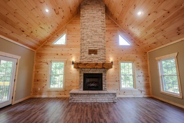 unfurnished living room featuring wood ceiling, a fireplace, and wood finished floors