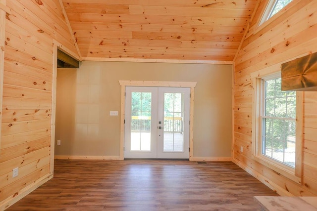 doorway with french doors, lofted ceiling, wood ceiling, wooden walls, and wood finished floors