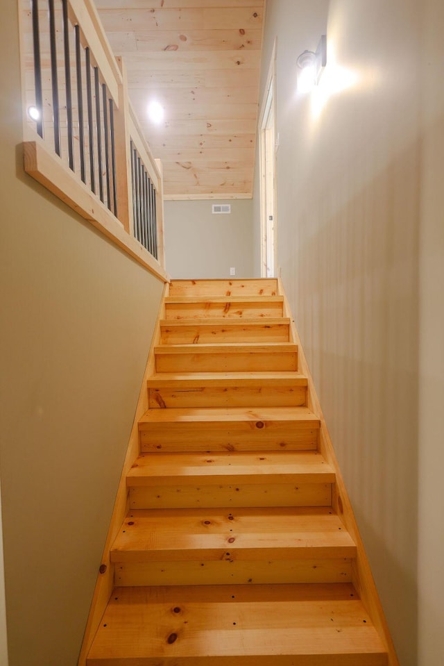 stairs featuring wood ceiling