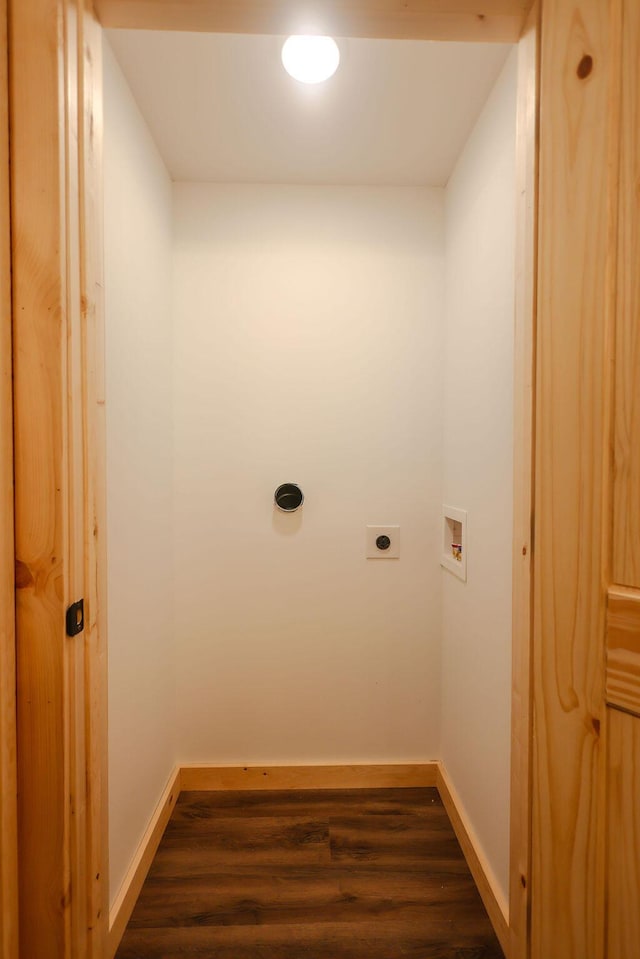 laundry area featuring dark wood finished floors, hookup for a washing machine, hookup for an electric dryer, laundry area, and baseboards