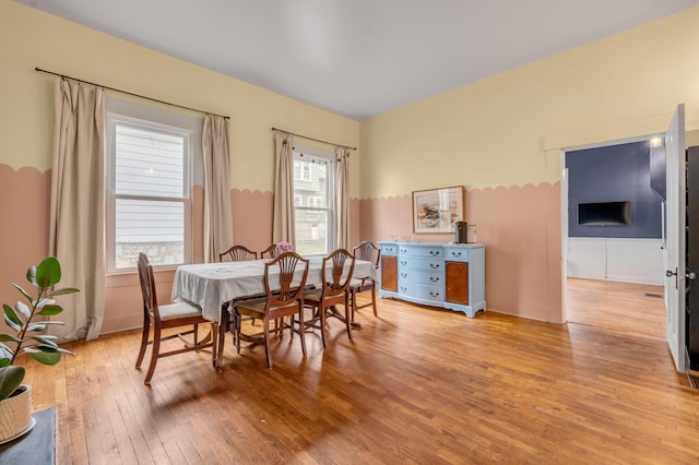 dining area with light wood-style flooring