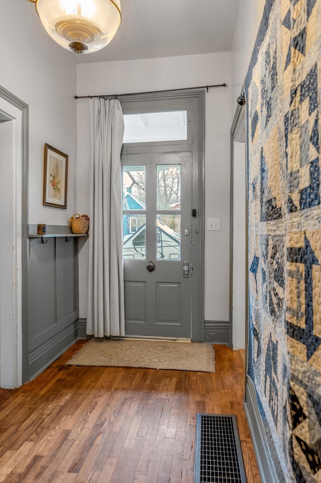 doorway to outside with hardwood / wood-style floors