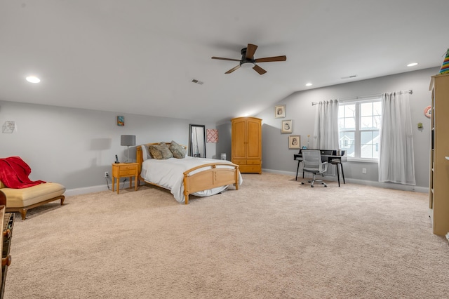 bedroom with light colored carpet, vaulted ceiling, visible vents, and baseboards