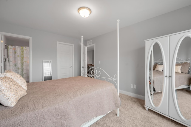 bedroom featuring carpet flooring, visible vents, and baseboards