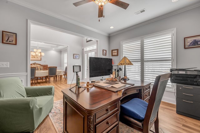 home office featuring crown molding, visible vents, light wood-style floors, baseboards, and ceiling fan with notable chandelier