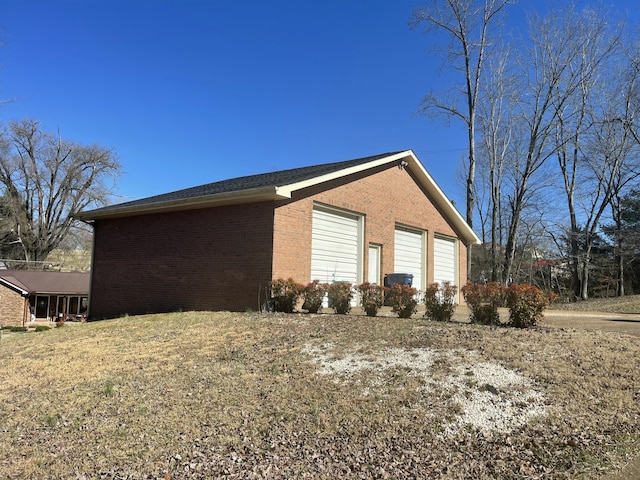 view of side of home featuring brick siding