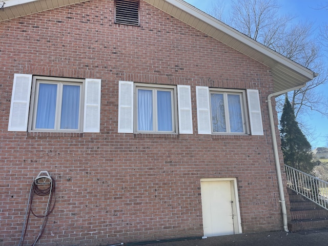 view of home's exterior with brick siding