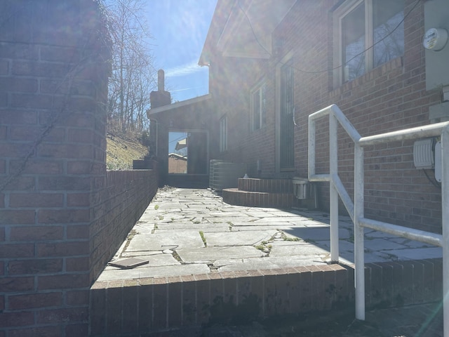 exterior space featuring brick siding