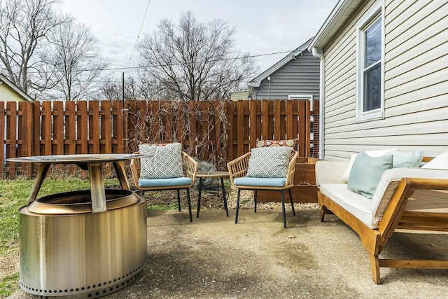 deck featuring outdoor lounge area, a patio area, and fence