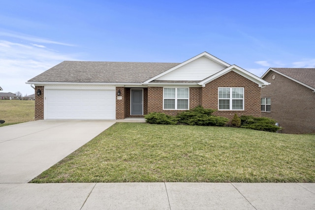 ranch-style home featuring an attached garage, a front yard, and brick siding