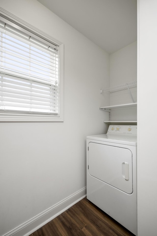 laundry room featuring washer / dryer, baseboards, dark wood-style floors, and laundry area