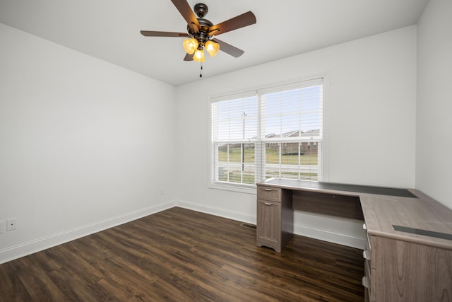 unfurnished office featuring ceiling fan, visible vents, baseboards, and dark wood-type flooring