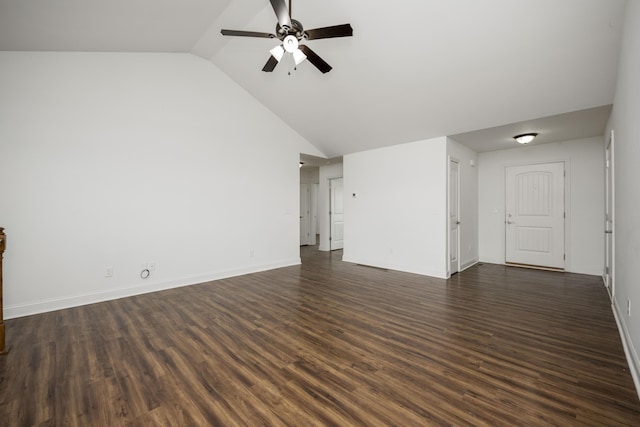 unfurnished living room with dark wood-style floors, lofted ceiling, ceiling fan, and baseboards