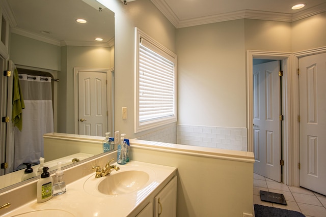 full bathroom featuring double vanity, ornamental molding, tile patterned floors, a sink, and recessed lighting